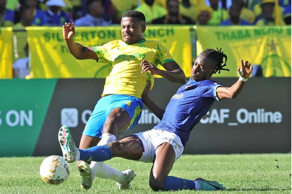 Mamelodi Sundowns' Tebogo Mokoena is challenged by Esperance's Ibrahima Keita during-the CAF Champions league semifinal